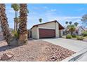 Single-story home with attached garage and well-maintained desert landscaping at 4716 Mountain Valley Rd, Las Vegas, NV 89121