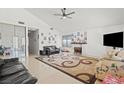 Bright living room features a vaulted ceiling and large area rug at 4716 Mountain Valley Rd, Las Vegas, NV 89121