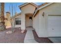 Front entry of the house with a security door and walkway at 6425 Mountain Mesa Ave, Las Vegas, NV 89156