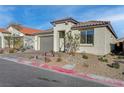 Charming single-story home with a well-manicured desert landscape and a two-car garage at 6544 Sandero Springs St, Las Vegas, NV 89166