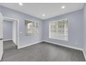 Well-lit bedroom with large windows and neutral gray paint at 7135 S Durango Dr # 209, Las Vegas, NV 89113