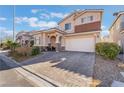 Lovely two-story home with a paved driveway, two-car garage, and manicured landscaping at 7321 Aspire Ct, Las Vegas, NV 89113