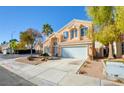 Two-story house with attached garage, and mature trees at 7337 Tealwood St, Las Vegas, NV 89131