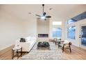 Cozy living room with modern fireplace, sleek furniture and high ceilings at 7695 Silver Wells Rd, Las Vegas, NV 89149