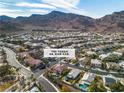 Aerial view of the home and neighborhood, showcasing its desirable location with mountain views at 790 Tossa De Mar Ave, Henderson, NV 89002