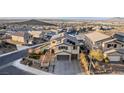 Expansive aerial view of home with backyard pool and solar panels at 864 Firestone Ledge Ave, Henderson, NV 89012