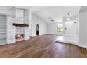 Spacious living room with a modern fireplace and hardwood floors at 9101 Dolphin Cove Ct, Las Vegas, NV 89117