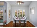 Bright dining room featuring hardwood floors, white trim, and elegant shutters at 9300 Villa Ridge Dr, Las Vegas, NV 89134