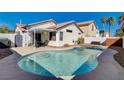 Enjoy backyard with a sparkling pool and patio, perfect for entertaining at 9995 Yellow Canary Ave, Las Vegas, NV 89117