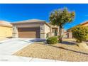 Inviting single-story house featuring a well-kept yard and a two-car garage at , Las Vegas, NV 89122