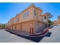 Image showcases an exterior view of garages beneath the condominiums, offering ample parking space at 107 Topsail Dr, Boulder City, NV 89005