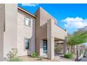 Contemporary two-story home with light-colored stone exterior and balcony at 11713 Redwood Mountain Ave, Las Vegas, NV 89138