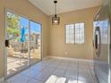 Eat in Dining area features glass doors to the exterior and good natural light at 1851 Hillpointe Rd # 2124, Henderson, NV 89074