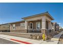 Charming single-story home featuring a covered porch and well-maintained landscaping at 216 Copland Canyon Ave, Henderson, NV 89011