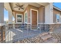 Inviting front porch featuring a cozy seating area and decorative brick accents at 216 Copland Canyon Ave, Henderson, NV 89011