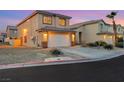 Two-story home boasting an attached garage and well-maintained landscaping at 2737 Sunrise Day Ct, Las Vegas, NV 89142