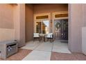 Welcoming front porch with seating area, double-door entrance, and decorative wreaths at 2987 Matese Dr, Henderson, NV 89052