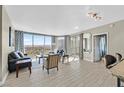 Spacious living room with floor-to-ceiling windows and stunning city views at 322 Karen Ave # 1101, Las Vegas, NV 89109