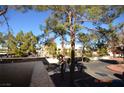 View of the community from a condo balcony, showing parking and landscaping at 3561 Arville St # 801B, Las Vegas, NV 89103