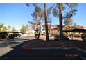 Condo community parking area with covered parking spaces at 3561 Arville St # 801B, Las Vegas, NV 89103