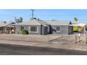 Newly renovated gray single-story home with a fenced yard at 465 Federal St, Henderson, NV 89015