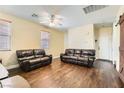 Inviting living room with wood floors, neutral walls, and comfortable seating at 5329 Fireside Ranch Ave, Las Vegas, NV 89131