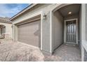 Close-up of the front entrance with a brick driveway and arched entryway at 6016 La Coste St, North Las Vegas, NV 89081