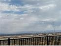 Panoramic back view featuring distant hillside and city views from fenced yard at 6154 Rathbone St, Las Vegas, NV 89166