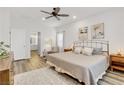 Serene bedroom with neutral tones, ample natural light, and an en-suite bathroom at 92 Starlight Sonata Ave, Henderson, NV 89015