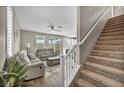 View of the staircase leading upstairs from the living room at 10211 Starlit Canyon Ct, Las Vegas, NV 89141