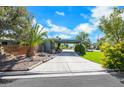 House with carport and beautifully landscaped front yard at 1808 Birch St, Las Vegas, NV 89102