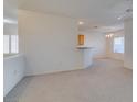 Inviting living room with neutral carpeting and a ceiling fan at 2192 Tiger Links Dr, Henderson, NV 89012