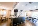 Recreation room with bar area, pool table, and sliding glass doors leading to the backyard at 2793 Red Arrow Dr, Las Vegas, NV 89135