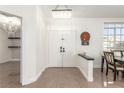 Bright entryway with double doors, chandelier, and tile floors at 286 Fairmeadow St, Henderson, NV 89012