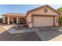 One-story house with a two-car garage and gravel driveway at 286 Fairmeadow St, Henderson, NV 89012