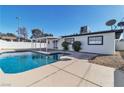 Backyard with a sparkling pool and shaded patio area, perfect for outdoor entertaining at 3700 San Angelo Ave, Las Vegas, NV 89102