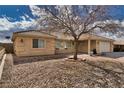 Charming single-story home with a well-manicured desert landscape and a spacious two-car garage at 3714 Mount Charleston Dr, Pahrump, NV 89048