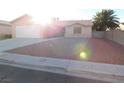 Gravel front yard with a single-story house and palm tree at 4225 Seth Dr, North Las Vegas, NV 89032