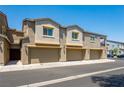 Three-unit townhome building with attached garages at 4495 Violet Flowers St # 2046, North Las Vegas, NV 89031