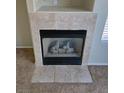 Gas fireplace with tile surround at 5018 Rio Linda Cir, North Las Vegas, NV 89031