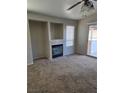 Living room with fireplace and sliding door to patio at 5018 Rio Linda Cir, North Las Vegas, NV 89031