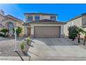 Charming two-story home featuring a two-car garage and low-maintenance desert landscaping at 6027 Stone Hollow Ave, Las Vegas, NV 89156