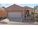 Charming single-story home showing desert landscaping and an attached two-car garage at 6151 Moonlight Sonata Ave, Las Vegas, NV 89122