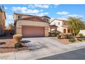 Two-story house with a two-car garage and desert landscaping at 6713 Chambers Lake Ct, North Las Vegas, NV 89084