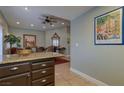 Kitchen boasts granite countertops and dark wood cabinetry at 7200 Big Rock Cir, Las Vegas, NV 89129