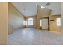 Bright living room features high ceilings, clerestory windows, neutral paint, and tile floors at 928 Allure Dr, Las Vegas, NV 89128