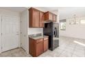 Eat-in kitchen with modern appliances, wooden cabinets, and adjacent dining area at 10221 Mayflower Bay Ave, Las Vegas, NV 89166