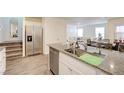 Open kitchen featuring granite countertops, stainless steel appliances, and seamless access to the living area at 1132 Ruby Sparrow St, Henderson, NV 89011