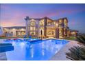 Inviting backyard with a large pool, slide, and spa, perfect for outdoor entertaining at 5764 Aspen Falls Cir, Las Vegas, NV 89149