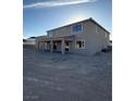 Backyard featuring an expansive unfinished landscape and a covered patio at 7142 Twilight Rider Ct, Las Vegas, NV 89118